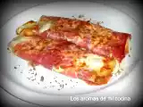 Receta Rollitos de tortilla rellenos de queso y envueltos en jamón.