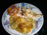 Receta Dorada a la espalda sobre cama de patatas con calamares a la romana crujientes.
